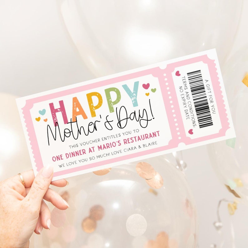 May include: A pink and white ticket-style gift voucher with the text "HAPPY Mother's Day!" in rainbow colors. The voucher says "This voucher entitles you to one dinner at Mario's Restaurant. We love you so much! Love Ciara & Blair"