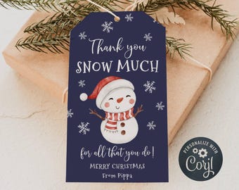 May include: A blue Christmas gift tag with a snowman illustration and the text "Thank you SNOW MUCH for all that you do! Merry Christmas From Pippa". The tag is decorated with snowflakes and has a personalized "Coril" logo.