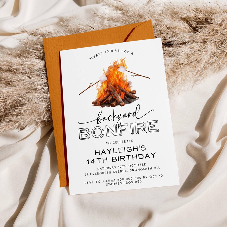May include: A white invitation with a black and white illustration of a campfire with marshmallows on sticks. The text reads "Please join us for a backyard bonfire to celebrate Hayleigh's 14th birthday. Saturday 17th October, 27 Evergreen Avenue, Snohomish WA. RSVP to Sienna 500 000 000 by Oct 10. S'mores provided."