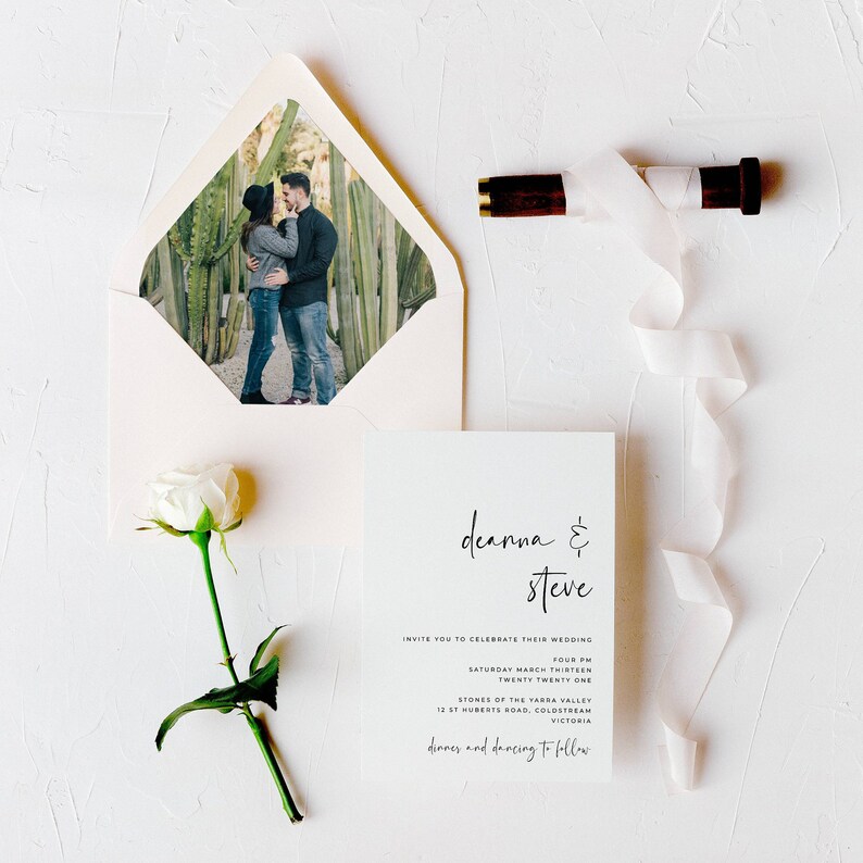 May include: A wedding invitation with a white background and black text. The invitation reads "deanna & steve" and includes the wedding date, time, and location. The invitation also includes the text "dinners and dancing to follow".