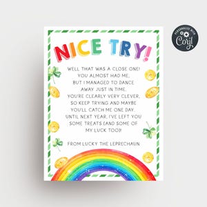 May include: A St. Patrick's Day card with the text "NICE TRY!" in various colours. The card includes a rainbow, gold coins, and shamrocks, with a message from Lucky the Leprechaun. The card has a green border.