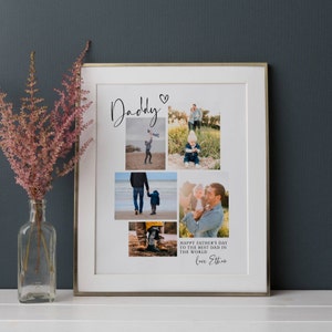 May include: A framed collage featuring family photos, with the word "Daddy" in script and a heart symbol. The photos show a father and child at the beach and in a field. Text at the bottom reads "Happy Father's Day to the best dad in the world" and "Love Ethan."