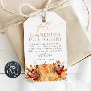 May include: A white gift tag with a fall-themed design. The tag features a handwritten "fall" in gold script, the words "Simmering Potpourri" in gold script, and instructions for using the potpourri. The tag is decorated with a watercolor illustration of a pumpkin, cinnamon sticks, star anise, and orange slices.