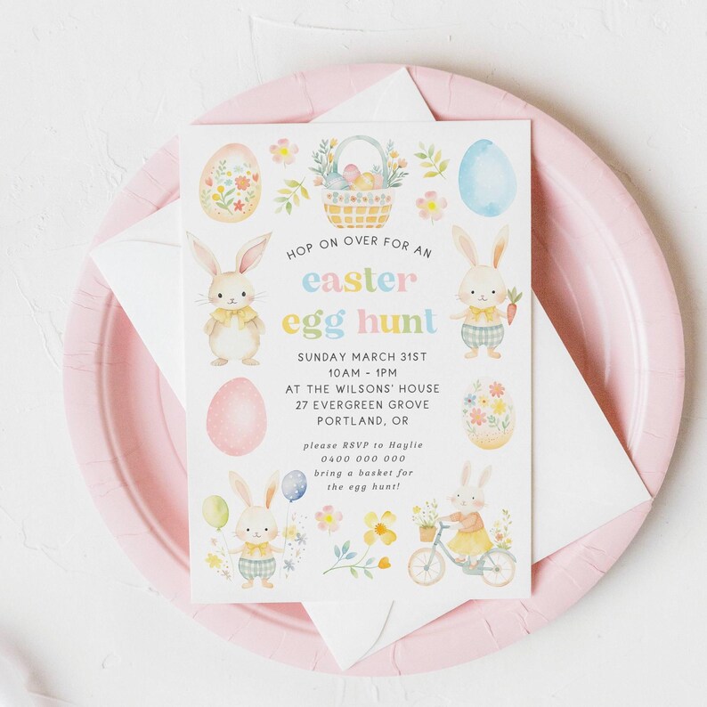 May include: An Easter egg hunt invitation on a white card with pastel illustrations of bunnies, eggs, and flowers. The card is on a pink plate with a white envelope. Text includes "Easter Egg Hunt" and event details.