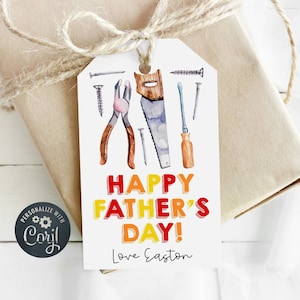 May include: A white gift tag with a watercolor illustration of tools, including a saw, pliers, and screws. The text "Happy Father's Day!" is in colorful block letters, and the tag is signed "Love Easton".