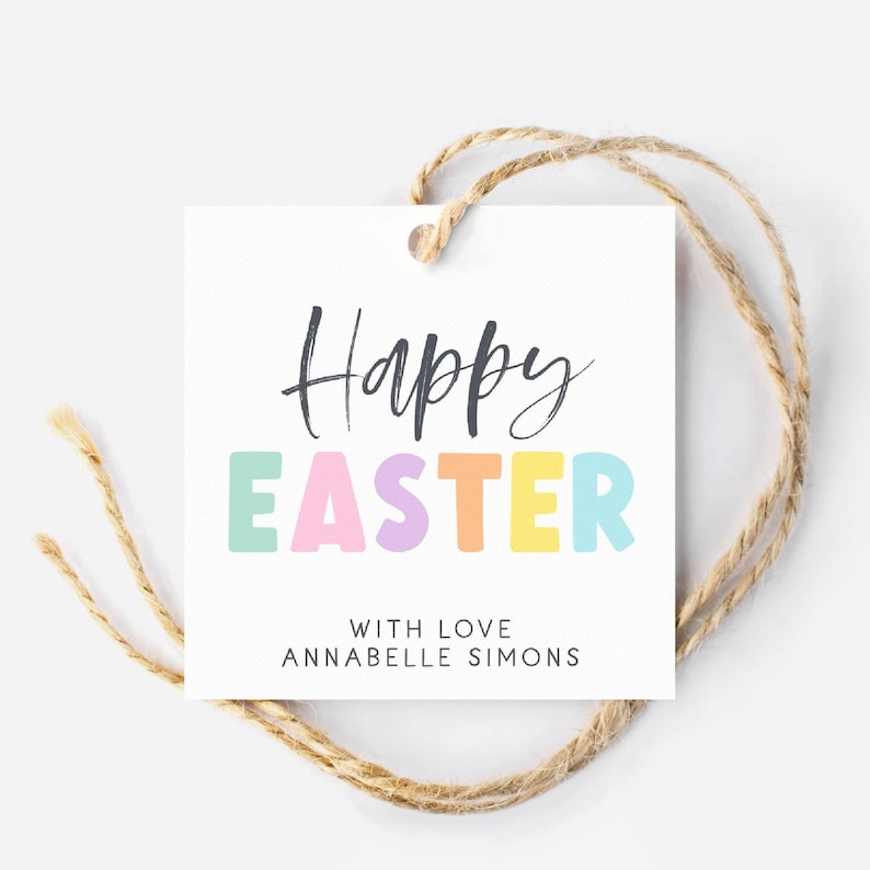May include: White gift tag with the text "Happy Easter" in black script font. The word "Easter" is in colorful block letters with a pastel color scheme. The text "With love, Annabelle Simons" is printed in black below the greeting.