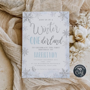 May include: A blue and silver winter wonderland themed first birthday party invitation with snowflakes and the text "Join us in a Winter One derland to celebrate the first birthday of Harriet May. Saturday December 16th 11am - 2pm at the Richardson Residence 77 Birch Rd, Portland RSVP to Juliette (555) 000 000"
