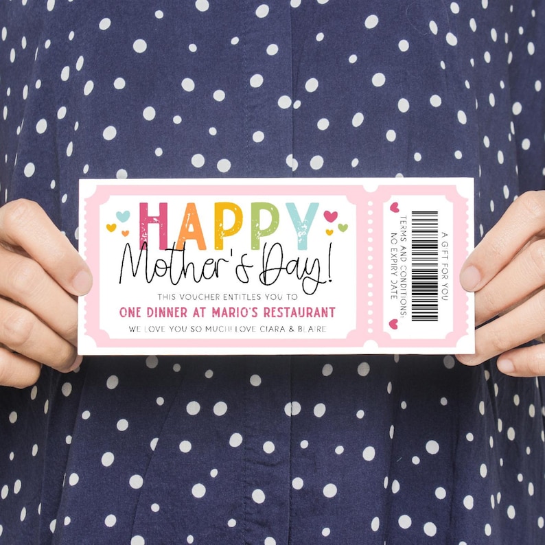 May include: A pink and white gift certificate with the text "HAPPY Mother's Day!" in colorful letters. The certificate says "This voucher entitles you to one dinner at Mario's Restaurant. We love you so much! Love Ciara & Bare."