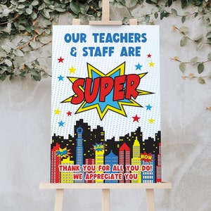 May include: A printable sign with a superhero theme. The sign says "Our teachers & staff are super" with a red and yellow starburst graphic. The background is blue and white with a cityscape and the words "BAM", "POW", and "WOW". The sign also says "Thank you for all you do! We appreciate you!"