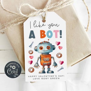 May include: A white gift tag with a robot illustration and the text "I like you a BOT!" in colorful letters. The tag also includes the text "Happy Valentine's Day! Love Rory Green."