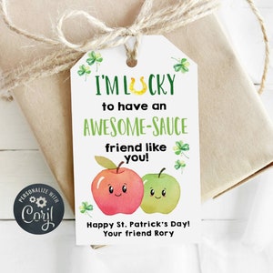 May include: A white gift tag with green shamrocks and a red and green apple illustration. The tag reads "I'm Lucky to have an Awesome-Sauce friend like you! Happy St. Patrick's Day! Your friend Rory."