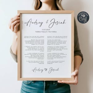 May include: A white printable art print with a black frame. The print features a wedding vow text for a couple named Audrey and Josiah. The text includes the date 13.03.2024 and the location Yarra Valley, Victoria.