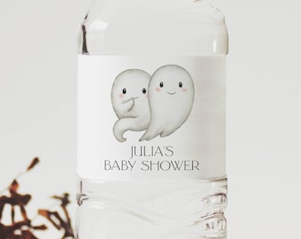 May include: A white water bottle label with two cartoon ghosts and the text "Julia's Baby Shower".