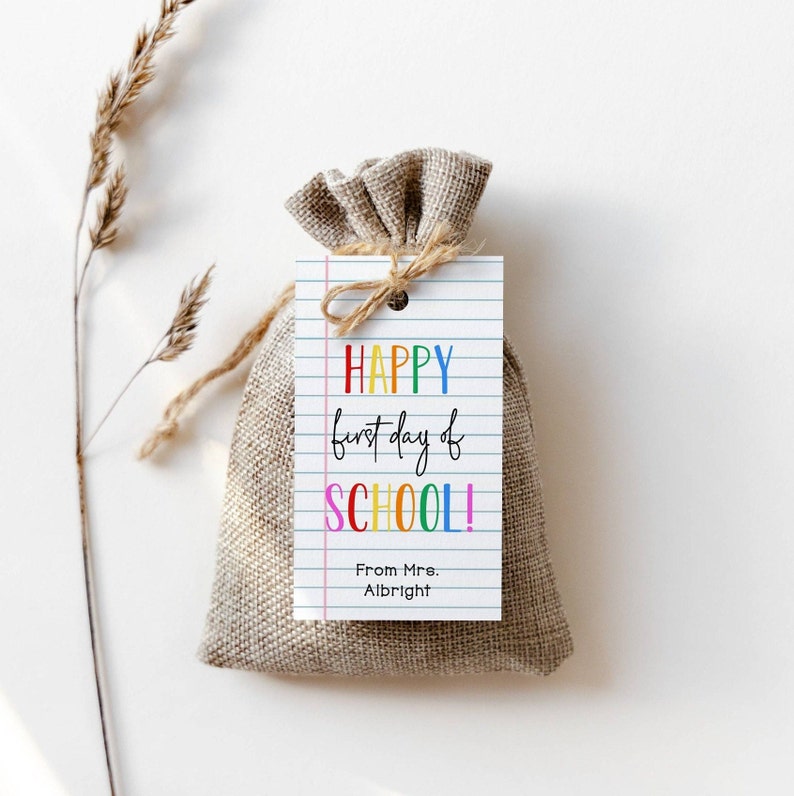 May include: A small burlap bag with a gift tag that says "HAPPY first day of SCHOOL!" in rainbow colors. The tag also says "From Mrs. Albright".