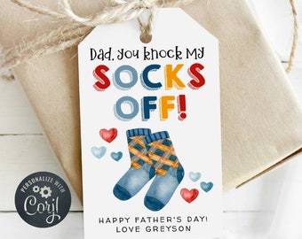 May include: A white gift tag with a colorful illustration of socks and the text "Dad, you knock my socks off!"  Happy Father's Day! Love Greyson.