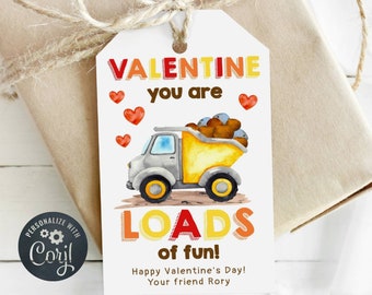 May include: A white Valentine's Day gift tag with a yellow dump truck carrying brown rocks. The text reads "VALENTINE you are LOADS of fun! Happy Valentine's Day! Your friend Rory."