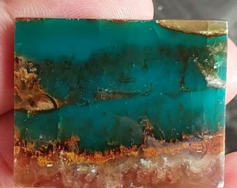 Cabochão de madeira opalizada azul (28,3 x 35,5 mm)