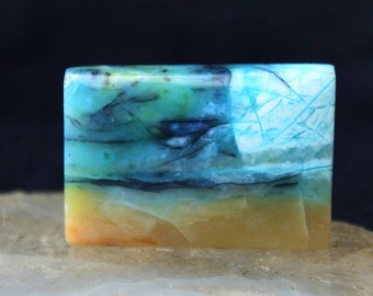 Pedra de madeira petrificada opalizada azul, com padrão indonésio (19,2 x 28,5 x 5 mm)