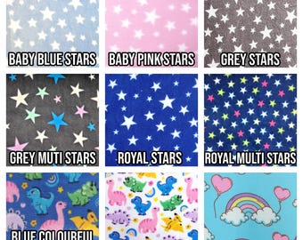 May include: A collage of nine fabric swatches featuring different patterns, including stars, dinosaurs, and rainbows. The swatches are labeled with names like "Baby Blue Stars", "Royal Stars", and "Rainbow Hearts".