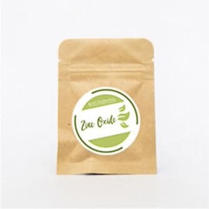 May include: A brown paper pouch with a white circle label that says "Skin Essentials" and "Zinc Oxide" in green lettering. The label has a green leaf design.