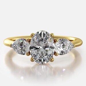 Oval and Pear Cut Three Stone Moissanite Engagement Ring In 10K Solid White/Yellow Gold or Sterling Silver