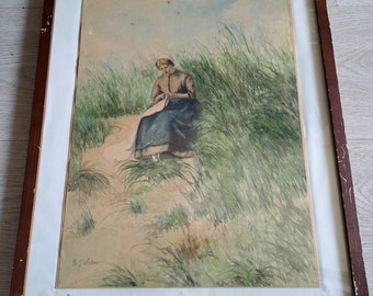 Ca,1940er Jahre - ein hübsches antikes holländisches Aquarellgemälde einer holländischen Dame, die in den Dünen nähen und wahrscheinlich auf die Rückkehr der Fischer wartet
