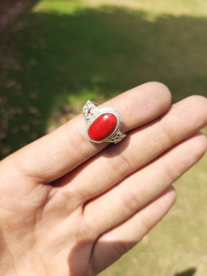 Red stone 2024 ring meaning
