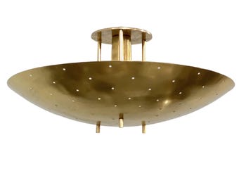 May include: A brass ceiling light fixture featuring a wide, shallow, bowl-shaped shade with a perforated pattern of small circular holes. The fixture is suspended by a central cylindrical mount with three vertical support rods.