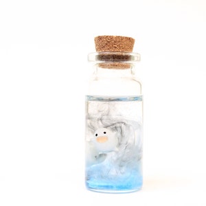 Studio Ghibli inspired Warawara creatures encased in a glass bottle, depicting a beautiful sky scene