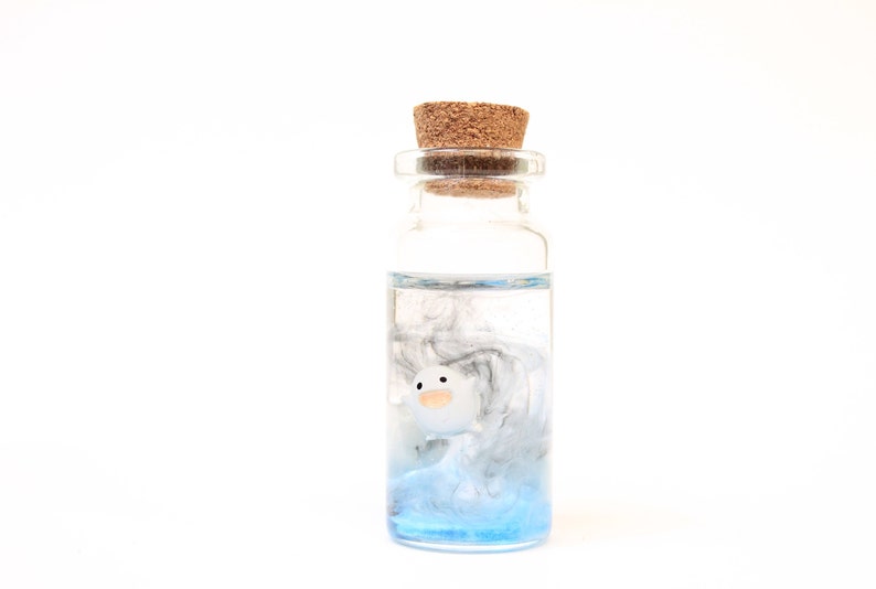 Studio Ghibli inspired Warawara creatures encased in a glass bottle, depicting a beautiful sky scene