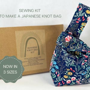 Image shows a sewing kit to make a Japanese Knot Bag with the box in the background and 
a readymade bag is on the right to demonstrate the finished product