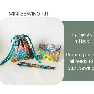 May include: A mini sewing kit featuring a drawstring pouch, a small envelope-style wallet with a button, and a wrist strap, all in a floral fabric. Text reads: MINI SEWING KIT, 3 projects in 1 box, Pre-cut pieces all ready to start sewing.