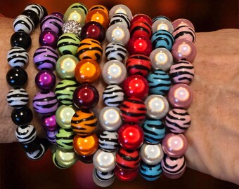 Zebra Magic, shimmering 3D bracelets with 10 mm beads, elastic, assorted colors