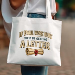 Canvas tote bag with "If Paul Were Here We'd Be Getting A Letter" text and scroll.