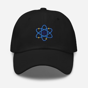 May include: Black baseball cap with a blue and yellow embroidered atom design. The cap features a curved brim and an adjustable strap at the back. The atom design is a stylized representation of an atom.