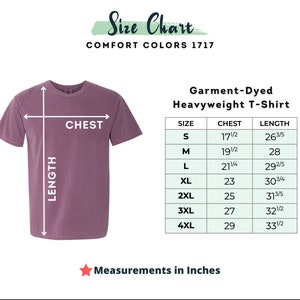 May include: A size chart for a Comfort Colors 1717 garment-dyed heavyweight t-shirt in a muted purple color. The chart displays chest and length measurements in inches for sizes S through 4XL, with arrows indicating where to measure on the t-shirt.