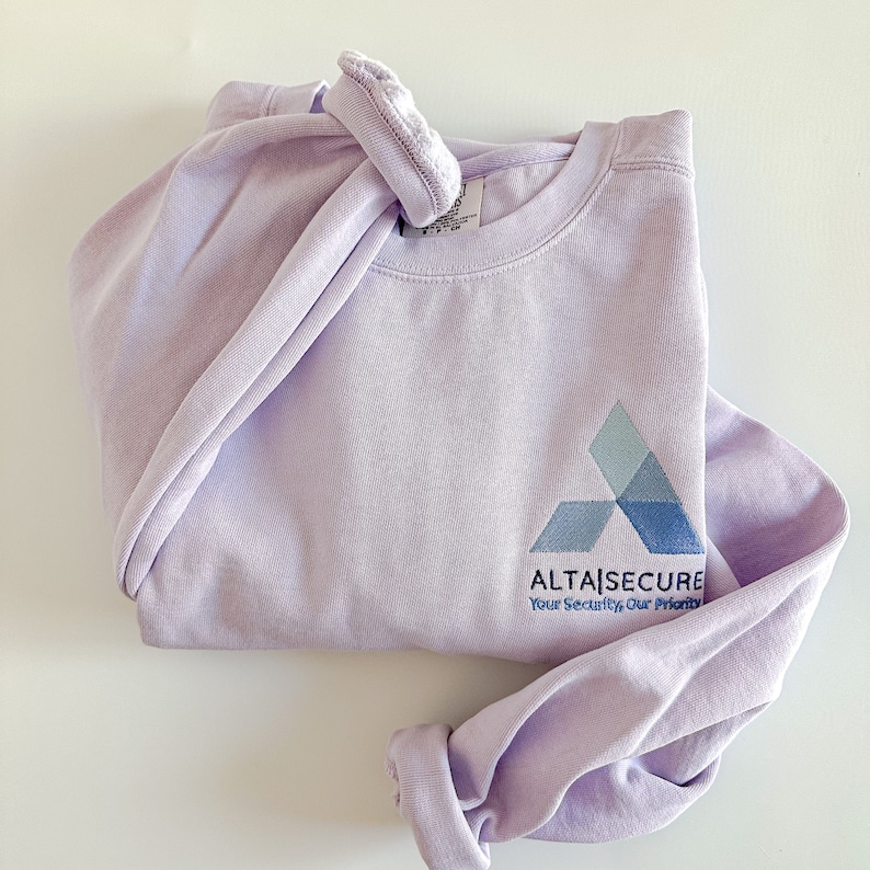 May include: A lavender colored sweatshirt with a blue and gray logo that says "AltaSecure" and "Your Security, Our Priority".