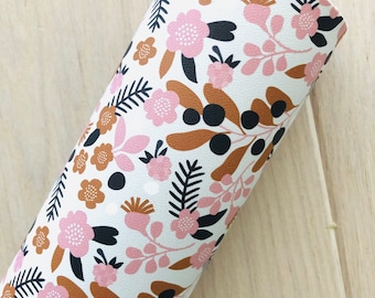 May include: A roll of white faux leather with a floral pattern in shades of pink, brown, and black.