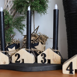 Rustic wooden houses as an Advent wreath, Advent decoration, Christmas decoration