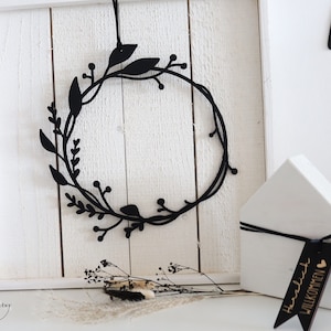 Filigree wooden wreath in black with three-quarter flower tendrils, wall decoration, door wreath, window decoration, door sign