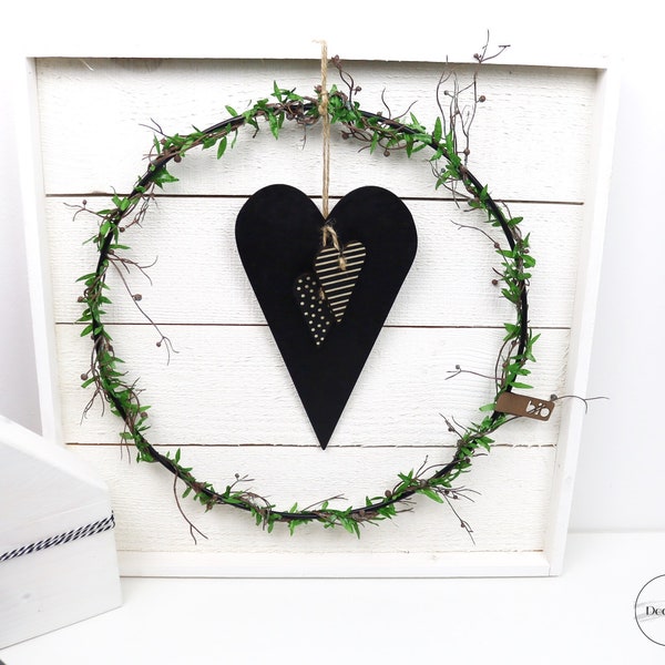 Wooden heart in a metal ring, spring wreath, metal loop, country house style, minimalist dried flower decoration