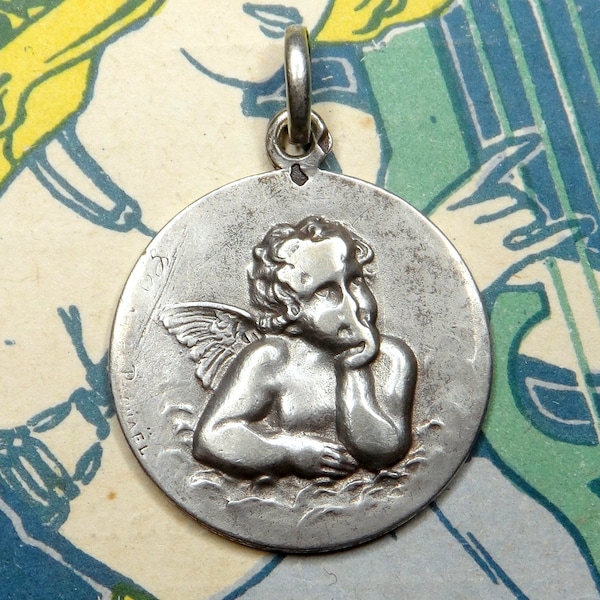 Cherub, Raphael. Antique Religious Pendant. Silver Medal.