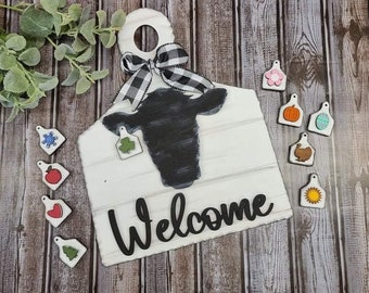 Cow sign with interchangeable ear tags