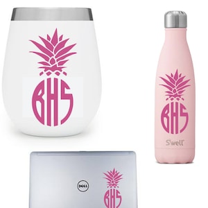 May include: A set of three items featuring a pink pineapple design with the monogram "BHS". The set includes a white wine tumbler, a pink S'well water bottle, and a silver laptop with a Dell logo.