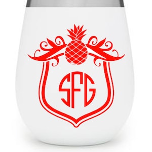 May include: White stainless steel wine tumbler with a red pineapple and monogram "SFG" in a crest design.