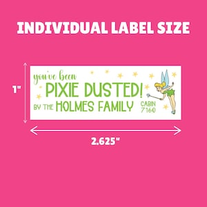 May include: A white label with green text that reads "you've been PIXIE DUSTED! BY THE HOLMES FAMILY CABIN 7160". The label is 1 inch tall and 2.625 inches wide. A cartoon image of Tinkerbell with a wand is on the right side of the label.
