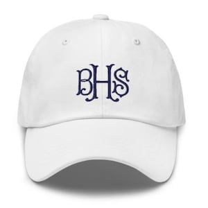 May include: White baseball cap with a navy blue embroidered monogram that reads "BHS".