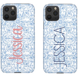 May include: Two white phone cases with a blue and white floral pattern. The left case has the name "Jessica" in pink lettering. The right case has the name "Jessica" in blue lettering.