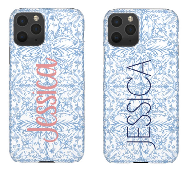May include: Two white phone cases with a blue and white floral pattern. The left case has the name "Jessica" in pink lettering. The right case has the name "Jessica" in blue lettering.