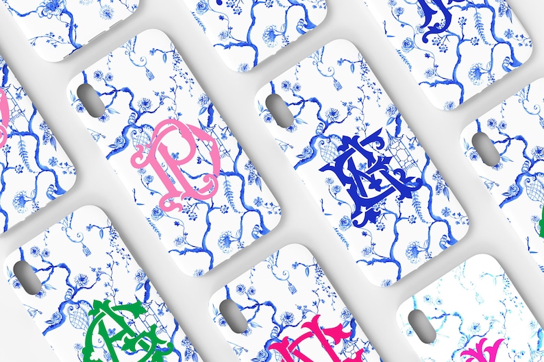 May include: A set of six white phone cases with a blue and white floral pattern. Each case features a different colored monogram in the center.